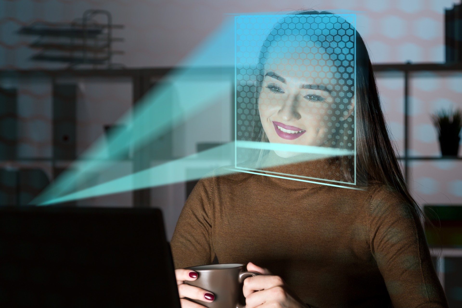 smiling-businesswoman-brown-sweater-using-laptop-with-face-recognition-technology-dark-office.jpg