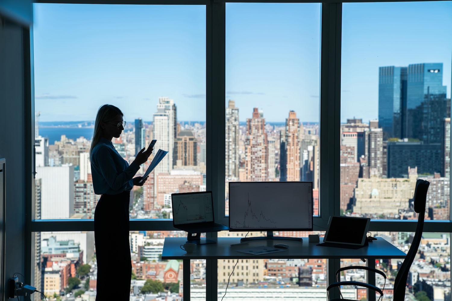 focused-female-manager-using-smartphone-in-office-2025-03-27-01-59-32-utc.jpg