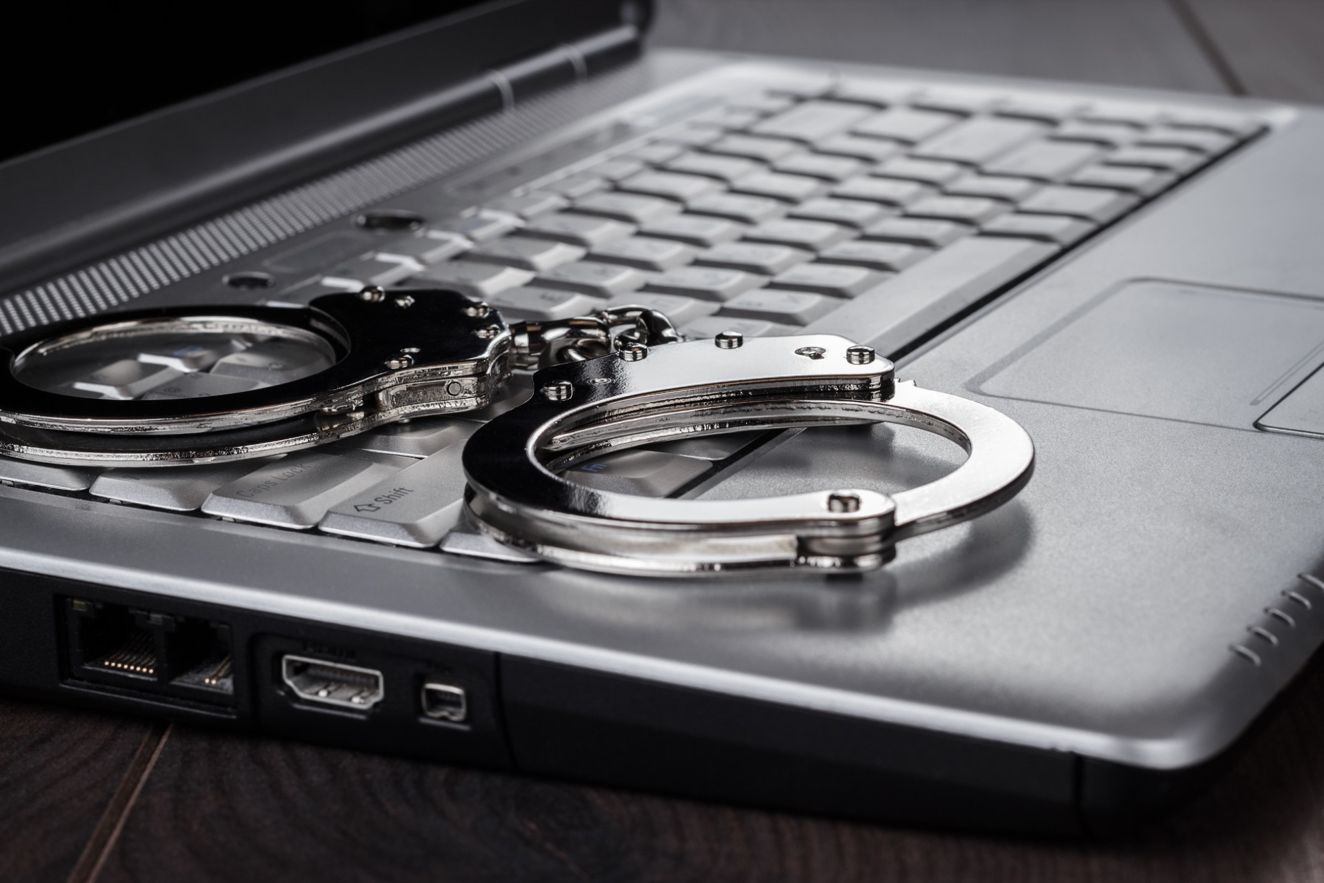 handcuffs-on-laptop-cyber-crime-concept-2023-11-27-04-58-57-utc.jpg