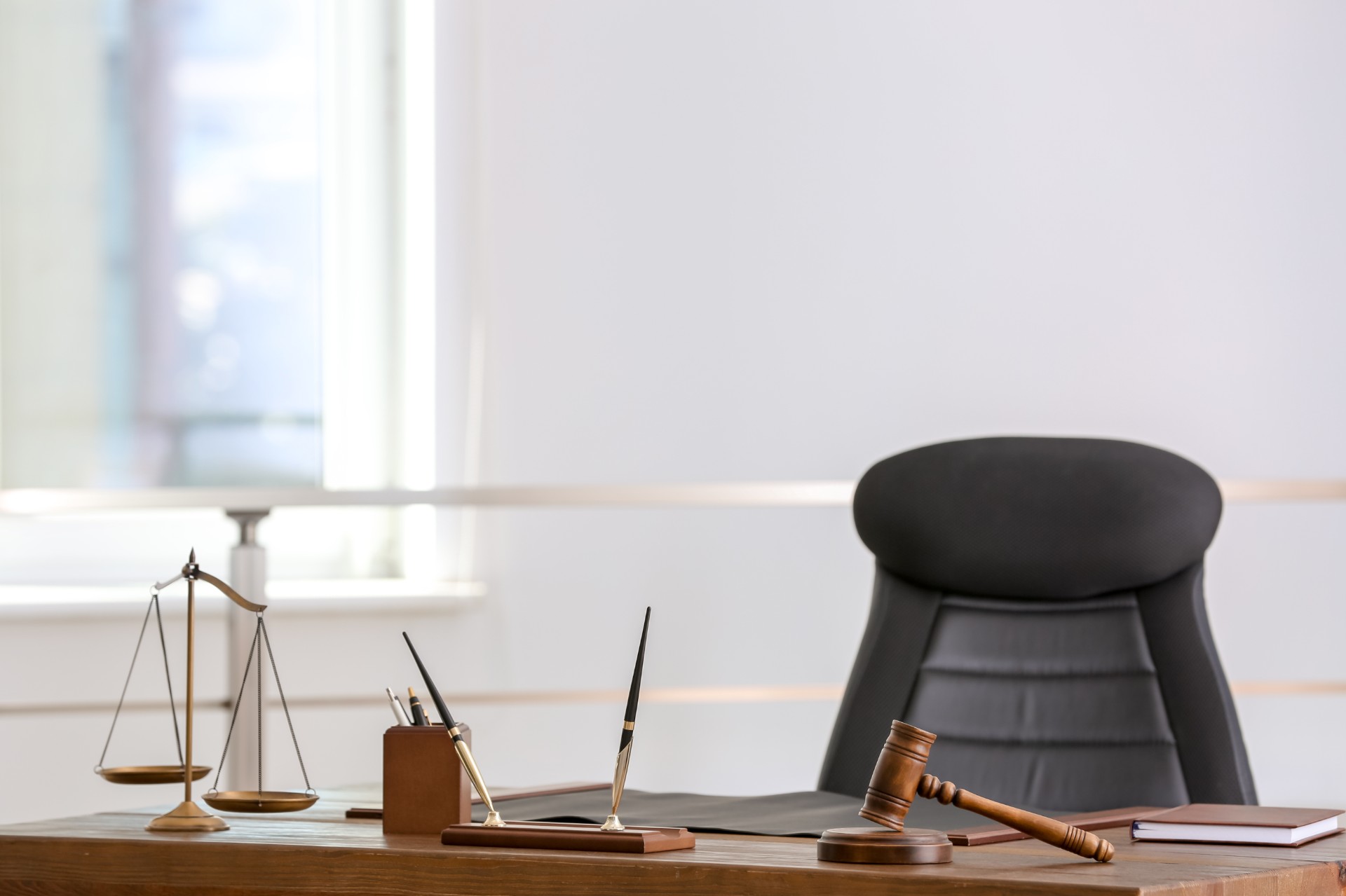 table-with-scales-of-justice-and-judge-gavel-in-la-2026-03-27-02-54-04-utc.jpg