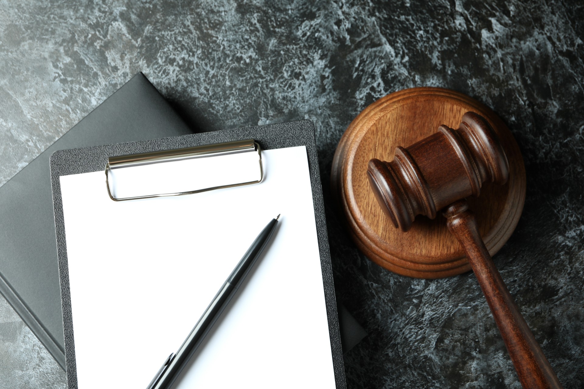 wooden-gavel-and-legal-documents-on-dark-surface-2026-01-09-07-42-00-utc.jpg