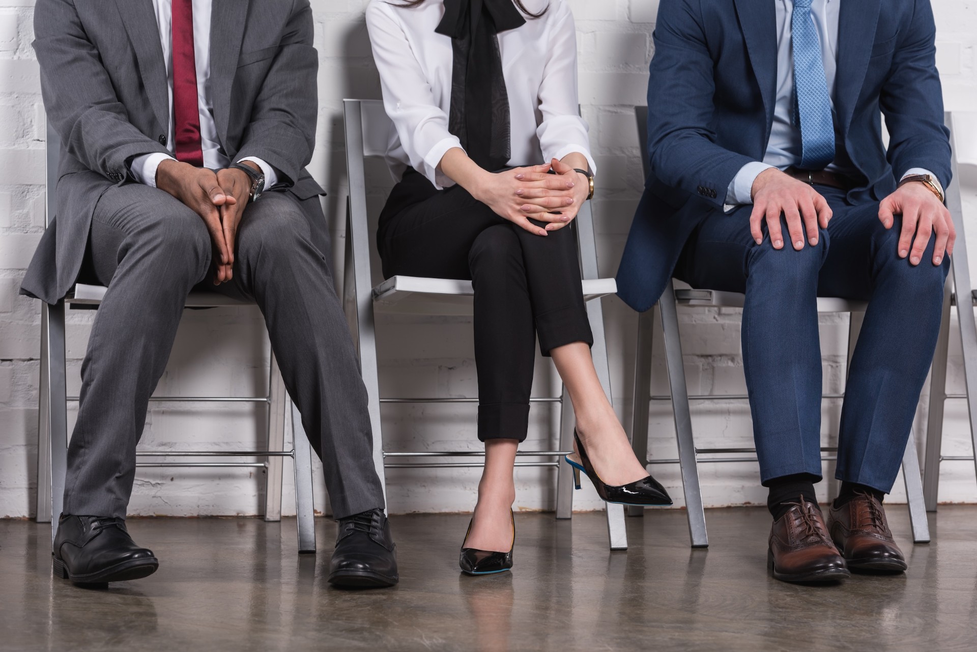 partial-view-of-multiethnic-business-people-sittin-2026-01-06-00-35-02-utc.jpg