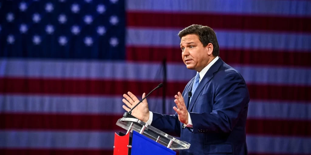 Florida Gov. Ron DeSantis, seen here February 24, 2022, signed into law a bill that would require private companies to use the E-Verify system.